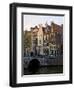 Netherlands, Amsterdam. Traditional houses along the canals and bridge crossing.-Julie Eggers-Framed Photographic Print