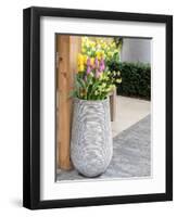 Netherlands, Lisse. Tall flower pot with yellow tulips and narcissus.-Julie Eggers-Framed Photographic Print