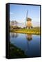 Netherlands, Lisse, Windmill on a Canal-Hollice Looney-Framed Stretched Canvas