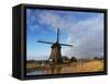 Netherlands, Nord Holland, Windmill along canal-Terry Eggers-Framed Stretched Canvas