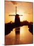 Netherlands, Nord Holland, Windmill along canal-Terry Eggers-Mounted Photographic Print