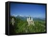 Neuschwanstein Castle on a Wooded Hill with Mountains in the Background, in Bavaria, Germany-null-Framed Stretched Canvas