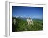 Neuschwanstein Castle on a Wooded Hill with Mountains in the Background, in Bavaria, Germany-null-Framed Photographic Print