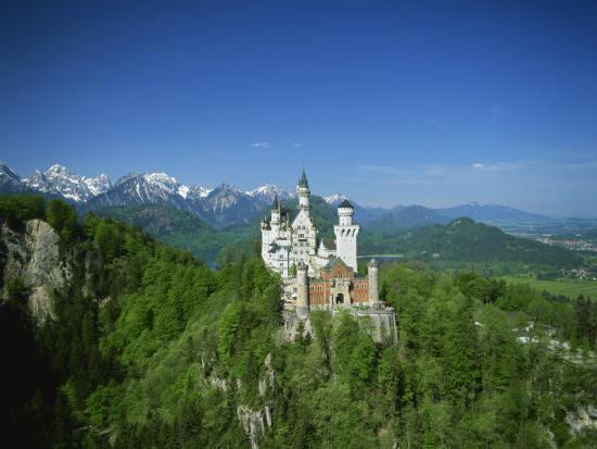 Neuschwanstein Castle on a Wooded Hill with Mountains in the Background, in  Bavaria, Germany' Photographic Print | AllPosters.com
