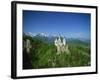 Neuschwanstein Castle on a Wooded Hill with Mountains in the Background, in Bavaria, Germany-null-Framed Photographic Print