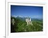 Neuschwanstein Castle on a Wooded Hill with Mountains in the Background, in Bavaria, Germany-null-Framed Photographic Print