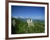 Neuschwanstein Castle on a Wooded Hill with Mountains in the Background, in Bavaria, Germany-null-Framed Photographic Print