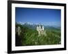 Neuschwanstein Castle on a Wooded Hill with Mountains in the Background, in Bavaria, Germany-null-Framed Photographic Print