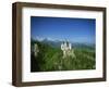 Neuschwanstein Castle on a Wooded Hill with Mountains in the Background, in Bavaria, Germany-null-Framed Photographic Print