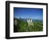 Neuschwanstein Castle on a Wooded Hill with Mountains in the Background, in Bavaria, Germany-null-Framed Photographic Print