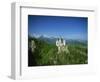 Neuschwanstein Castle on a Wooded Hill with Mountains in the Background, in Bavaria, Germany-null-Framed Photographic Print