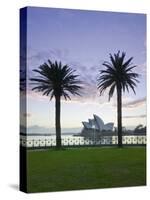 New South Wales, Sydney, Sydney Opera House Through Palms, Australia-Walter Bibikow-Stretched Canvas