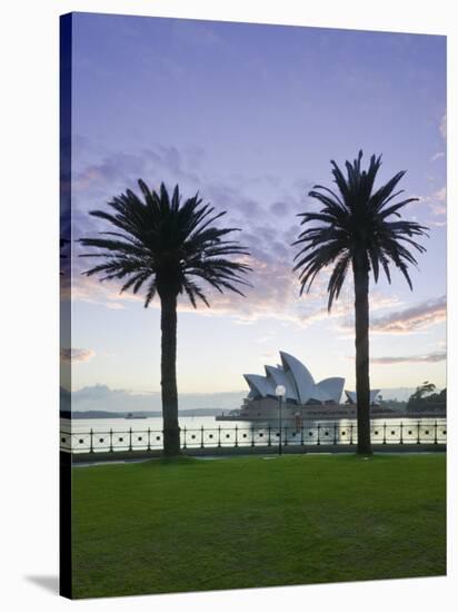 New South Wales, Sydney, Sydney Opera House Through Palms, Australia-Walter Bibikow-Stretched Canvas