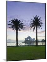 New South Wales, Sydney, Sydney Opera House Through Palms, Australia-Walter Bibikow-Mounted Photographic Print