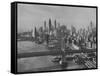 New York City Behind the Brooklyn and Manhattan Bridges That are Hovering over the East River-Dmitri Kessel-Framed Stretched Canvas