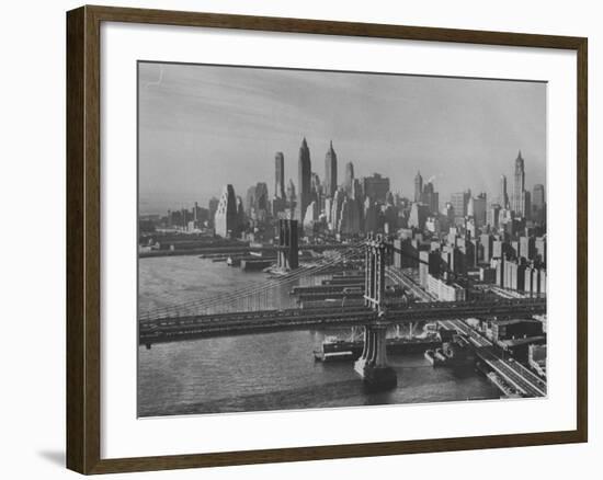 New York City Behind the Brooklyn and Manhattan Bridges That are Hovering over the East River-Dmitri Kessel-Framed Photographic Print