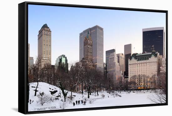 New York City Manhattan Central Park Panorama in Winter with Snow, Freezing Lake and Skyscrapers At-Songquan Deng-Framed Stretched Canvas