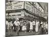 New York City Street Corner with Customers Ordering and Eating Nathan's Hot Dogs-null-Mounted Photo
