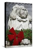 New York Public Library Lion Decorated with a Christmas Wreath during the Holidays.-Jon Hicks-Stretched Canvas