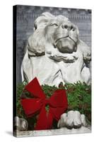 New York Public Library Lion Decorated with a Christmas Wreath during the Holidays.-Jon Hicks-Stretched Canvas