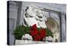 New York Public Library Lion Decorated with a Christmas Wreath during the Holidays.-Jon Hicks-Stretched Canvas