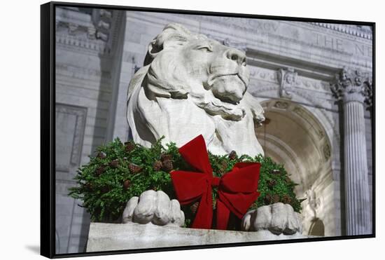 New York Public Library Lion Decorated with a Christmas Wreath during the Holidays.-Jon Hicks-Framed Stretched Canvas