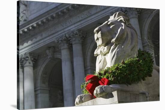 New York Public Library Lion Decorated with a Christmas Wreath during the Holidays.-Jon Hicks-Stretched Canvas