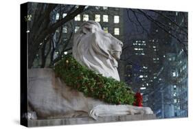 New York Public Library Lion Decorated with a Christmas Wreath during the Holidays.-Jon Hicks-Stretched Canvas