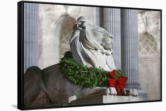 New York Public Library Lion Decorated with a Christmas Wreath during the Holidays.-Jon Hicks-Framed Stretched Canvas