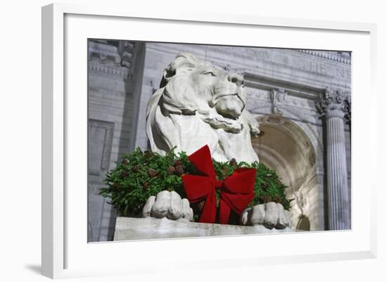 New York Public Library Lion Decorated with a Christmas Wreath during the Holidays.-Jon Hicks-Framed Photographic Print