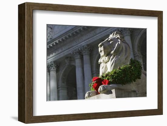 New York Public Library Lion Decorated with a Christmas Wreath during the Holidays.-Jon Hicks-Framed Photographic Print