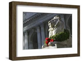 New York Public Library Lion Decorated with a Christmas Wreath during the Holidays.-Jon Hicks-Framed Photographic Print