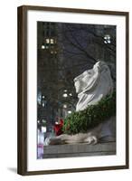 New York Public Library Lion Decorated with a Christmas Wreath during the Holidays.-Jon Hicks-Framed Photographic Print