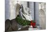 New York Public Library Lion Decorated with a Christmas Wreath during the Holidays.-Jon Hicks-Mounted Photographic Print