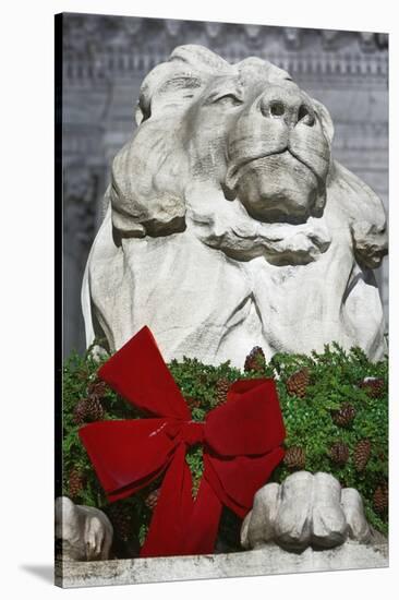 New York Public Library Lion Decorated with a Christmas Wreath during the Holidays.-Jon Hicks-Stretched Canvas