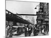 New York Street Scene, with Pedestrians Passing Pawn Shop with Elevated Sixth Ave. Subway Line-null-Mounted Photographic Print