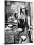New York Tenement Apartment with a Mother and Her Two Children, 1910-null-Mounted Photo