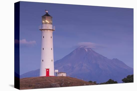 New Zealand, North Island, Pungarehu. Cape Egmont Lighthouse and Mt. Taranaki-Walter Bibikow-Stretched Canvas