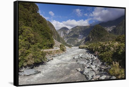 New Zealand, South Island, Fox Glacier Village, Fox Glacier hikers along Fox River-Walter Bibikow-Framed Stretched Canvas