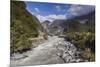 New Zealand, South Island, Fox Glacier Village, Fox Glacier hikers along Fox River-Walter Bibikow-Mounted Premium Photographic Print
