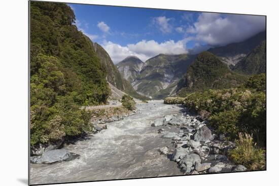 New Zealand, South Island, Fox Glacier Village, Fox Glacier hikers along Fox River-Walter Bibikow-Mounted Photographic Print