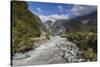 New Zealand, South Island, Fox Glacier Village, Fox Glacier hikers along Fox River-Walter Bibikow-Stretched Canvas