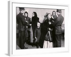 Newly Arrived Immigrants Undergoing Medical Examination on Ellis Island, New York, c.1910-null-Framed Photographic Print