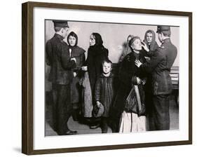 Newly Arrived Immigrants Undergoing Medical Examination on Ellis Island, New York, c.1910-null-Framed Photographic Print