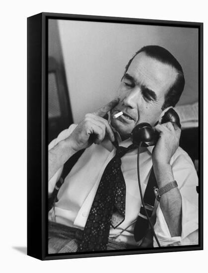 News Commentator, Edward R. Murrow with cigarette in mouth, tie loose, resting in his chair-Lisa Larsen-Framed Stretched Canvas