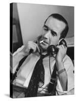 News Commentator, Edward R. Murrow with cigarette in mouth, tie loose, resting in his chair-Lisa Larsen-Stretched Canvas