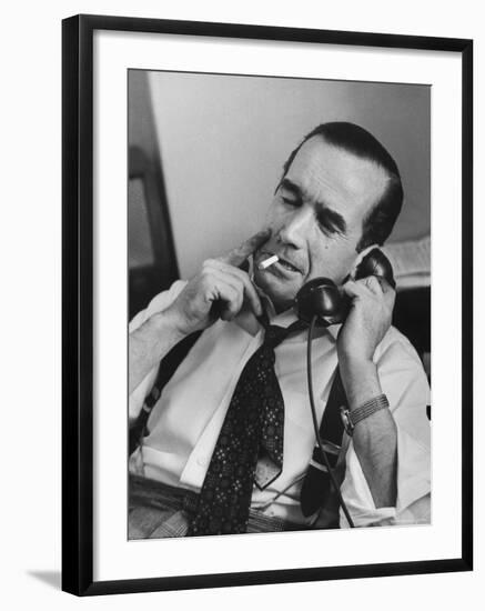 News Commentator, Edward R. Murrow with cigarette in mouth, tie loose, resting in his chair-Lisa Larsen-Framed Premium Photographic Print