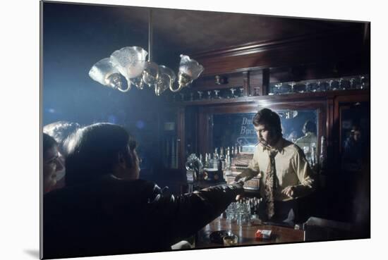 Nhl Boston Bruin Player Derek Sanderson Bartending at His Favorite Boston Bar, 1971-Art Rickerby-Mounted Photographic Print