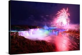 Niagara Falls Lit at Night by Colorful Lights with Fireworks-Songquan Deng-Stretched Canvas