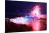 Niagara Falls Lit at Night by Colorful Lights with Fireworks-Songquan Deng-Mounted Photographic Print